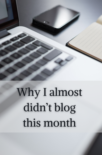 a laptop, phone, and pad and pen on a desk with the words Why I almost didn't blog this month