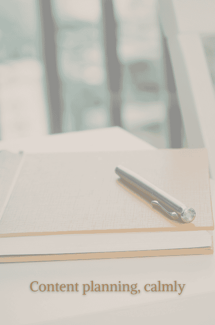 notebook and pen on a desk content planning calmly