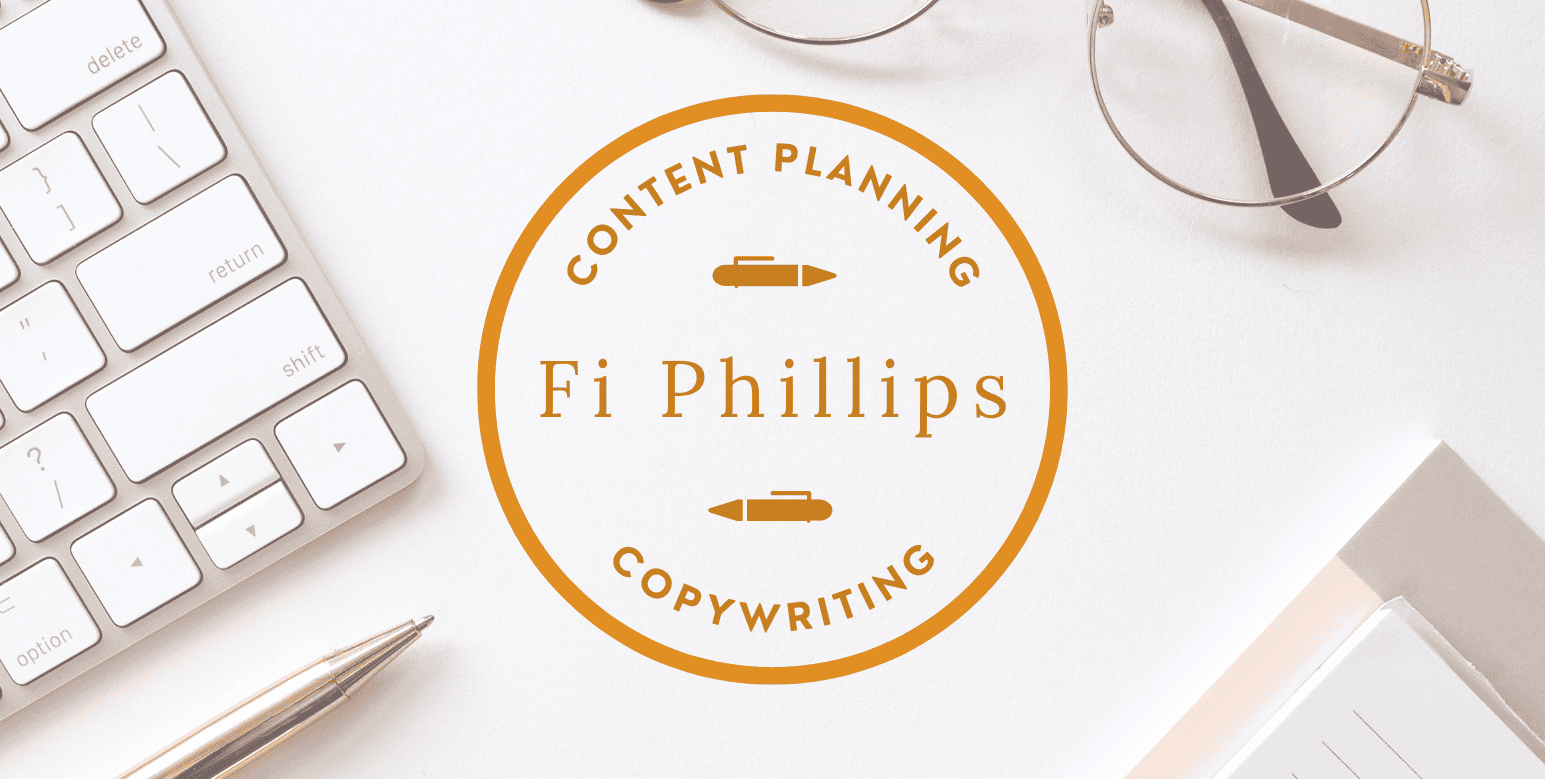 desk with keyboard, pen, pair of glasses, pad, and Fi Phillips Copywriter logo